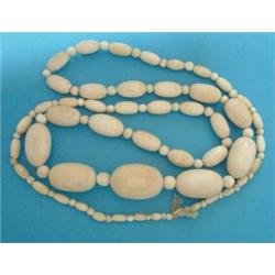 A single row necklace, of graduated ivory beads, 40ins £50-70...