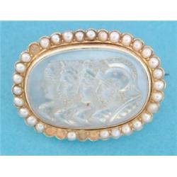 A gold moonstone cameo brooch, carved with four classical profiles, the frame set split pearls (f...