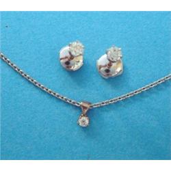A pair of white metal claw-set solitaire diamond ear studs, together with a single stone diamond...
