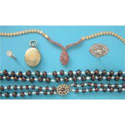A 2-row necklace, of graduated garnet beads and cultured pearls with 9ct gold oval cluster clasp...
