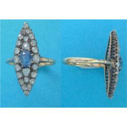 A Victorian gold marquise cluster ring, set with an oval sapphire and rose cut diamonds £250-300...