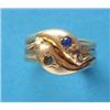 Image 1 : A gentleman's 18ct gold double snake head ring, gypsy set with a sapphire and an emerald £100-150...