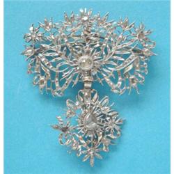 An 18th century Spanish silver and gold openwork pendant/brooch, of flowerhead foliate design, se...