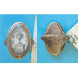 A George III gold memorial ring, the oval bezel inset with a painted panel depicting an urn and w...