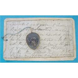 A Georgian gold framed pear shaped double sided memorial locket, inset plaited hair £50-70...