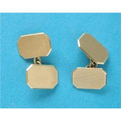 A pair of 18ct gold engine turned cufflinks, with chain connections, 10.1grms (cased) and a set o...