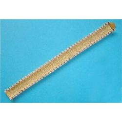 An 18ct gold bracelet, of textured flexible linking, claw set with 80 brilliant cut diamonds, 7in...