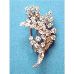A Boucheron, London, all diamond floral spray brooch, set brilliant, marquise and baguette cut st...