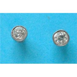 A pair of collet set diamond earstuds £150-200...