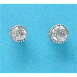 A near pair of collet set diamond earstuds £120-180...