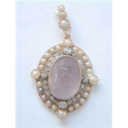 An Edwardian gold pendant, with amethyst carved portrait cameo within a rose diamond and split pe...