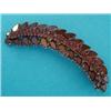 Image 1 : A late Victorian curved leaf shaped brooch, set flat cut garnets £70-100...