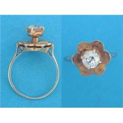 A gold solitaire diamond ring, with petal shaped bezel £300-400...