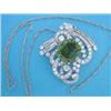 Image 1 : A white gold diamond and peridot brooch/pendant, of stylised scroll design, set brilliant and bag...