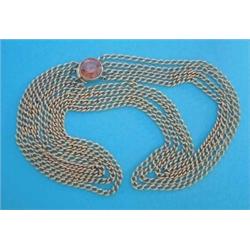 A 4-row curblink gilt metal necklace, with circular clasp set with a yellow zircon, together with...