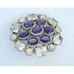 An oval openwork gold brooch/pendant, set split pearls together with an oval cluster brooch set c...