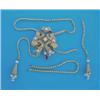 Image 1 : A gold snake link necklet, with seed pearl tassel drops having a tied ribbon slide set emeralds a...