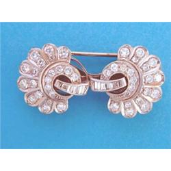 A pair of white gold diamond set earclips, designed as two stylised flowerheads, set brilliant an...