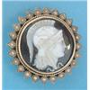 Image 1 : A Victorian gold circular banded agate cameo brooch carved with a classical profile within a blac...