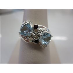 Ladies blue topaz, garnet & diamond dinner ring