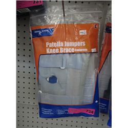 2 Hinged knee braces, in boxes.