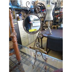 Mirror in a metal tri-foot stand