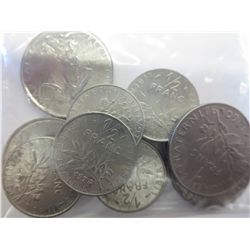 Bag filled with 12 French Franc pieces