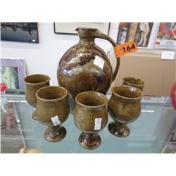 Glazed pottery jug and goblets