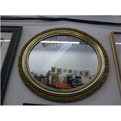 Framed oval mirror