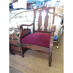 Antique carved oak chair with velvet upholstery