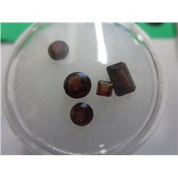 Gem jar: assorted cut genuine garnet gemstones