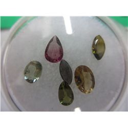 Gem jar: 2 assorted cut Tourmaline gemstones