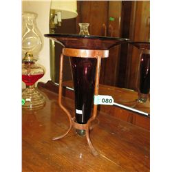 Amethyst glass vase in iron base