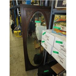 Vintage wooden door with oval mirror