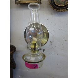 Vintage oil lamp in wall hanger