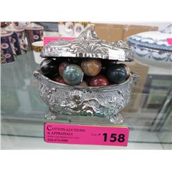 Silver plated jewelry box containing agate marbles