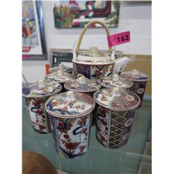 Tatung china teapot with 8 lidded teacups