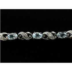 Six carat diamond & aquamarine tennis bracelet