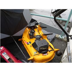 Grass cutting attachment for driving lawnmower