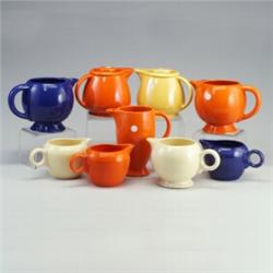 9 FIESTA pitchers, most without lids: 2 Kitchen Kraft water pitchers with lid in yellow and red (...