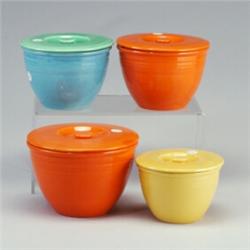 4 FIESTA mixing bowls with lids: 7 3/4" red (crack, line, and fleck to bowl), 6 3/4" light blue w...
