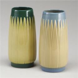 Two ROSEVILLE Lotus vases (L3-10"), one in blue and ivory, the other in green and yellow. Raised...