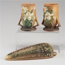 Three ROSEVILLE pieces: a pair of brown Magnolia vases (87-6") and a brown Florentine wallpocket....