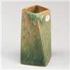 Image 1 : ROSEVILLE Futura twisted four-sided vase with branches and leaves on a mottled orange to green gr...