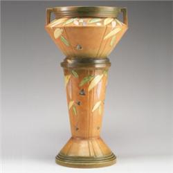 ROSEVILLE Futura jardiniere and pedestal with leaves in pastel tones on a brown ground. Jardinier...