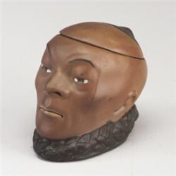 WELLER Dickensware Chinaman tobacco jar. Minor nick inside lid and glaze scaling to edge of braid...