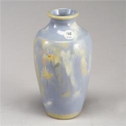WELLER Auroro vase with daisies on a pale blue ground. Minor 1/4" glaze inconsistency to rear of...