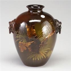 WELLER Louwelsa bulbous vase with lion medallions holding ring handles, and painted with palm fro...