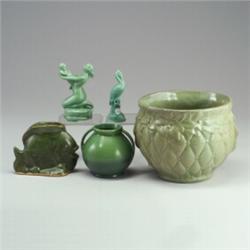 Five green pieces: two HAEGER figures, a jardiniere, a small vase, and a fish pillow vase. Some m...