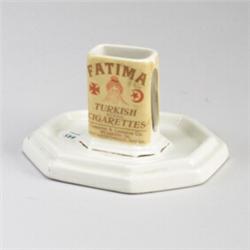 ROSEVILLE Creamware advertising matchbook holder for Fatima Turkish cigarettes. Wear to gilding,...